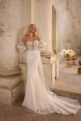 Romantic lace wedding dress featuring a sparkling embroidered corset, detachable overskirt, elegant off-the-shoulder straps, matching choker, and dramatic thigh-high slit.