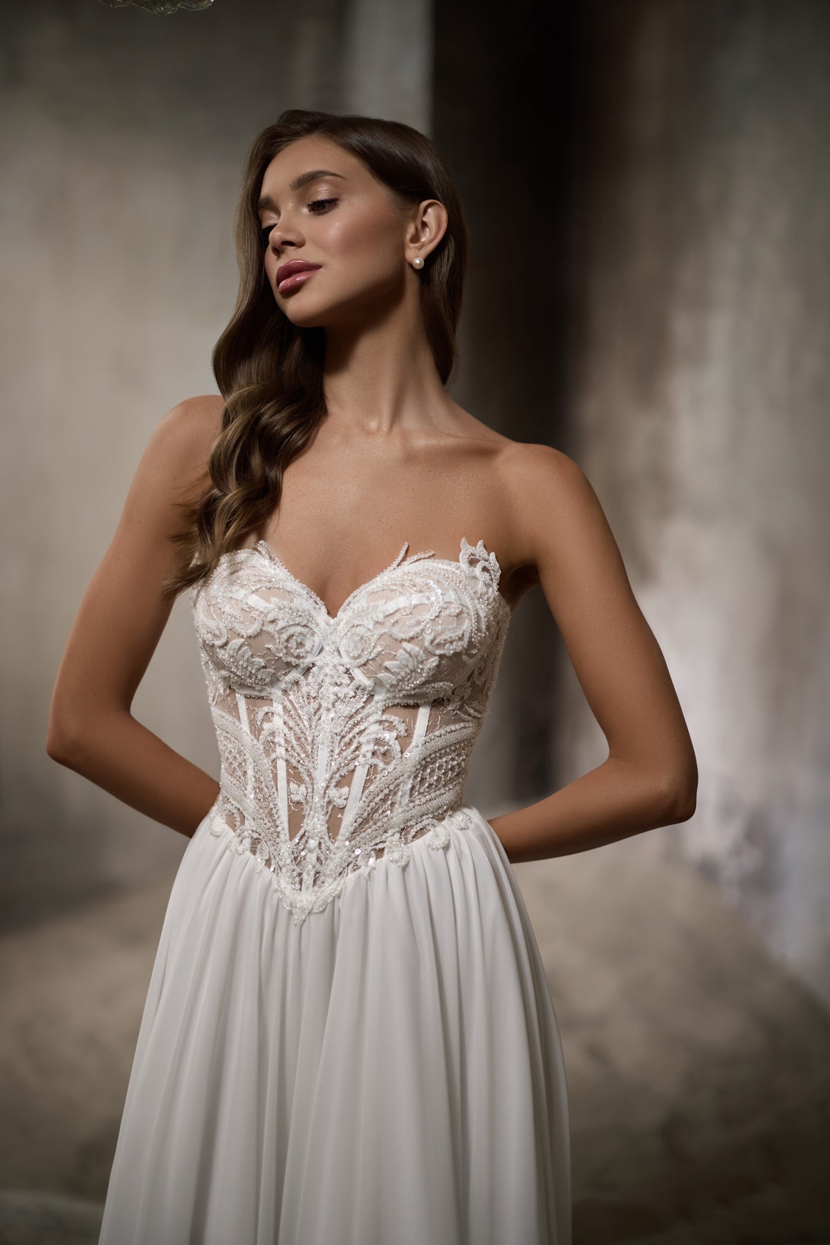 Ivory A-line wedding dress with a sweetheart neckline and intricate lace bodice over a flowing skirt