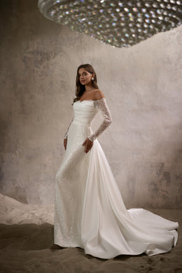 Ivory mermaid wedding dress with off-the-shoulder beaded sleeves and a long flowing train