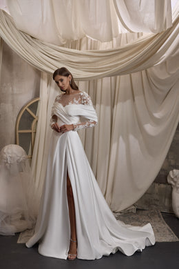 Ivory wedding dress with floral lace sleeves, an off-the-shoulder neckline, slit, and train