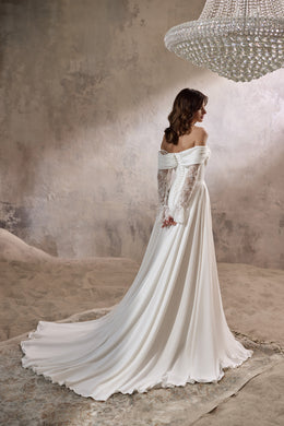 Ivory wedding dress with a lace-paneled back, off-the-shoulder sleeves, and a long flowing train