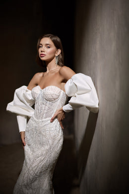 Ivory beaded mermaid wedding dress with a strapless sweetheart neckline and detachable puff sleeves