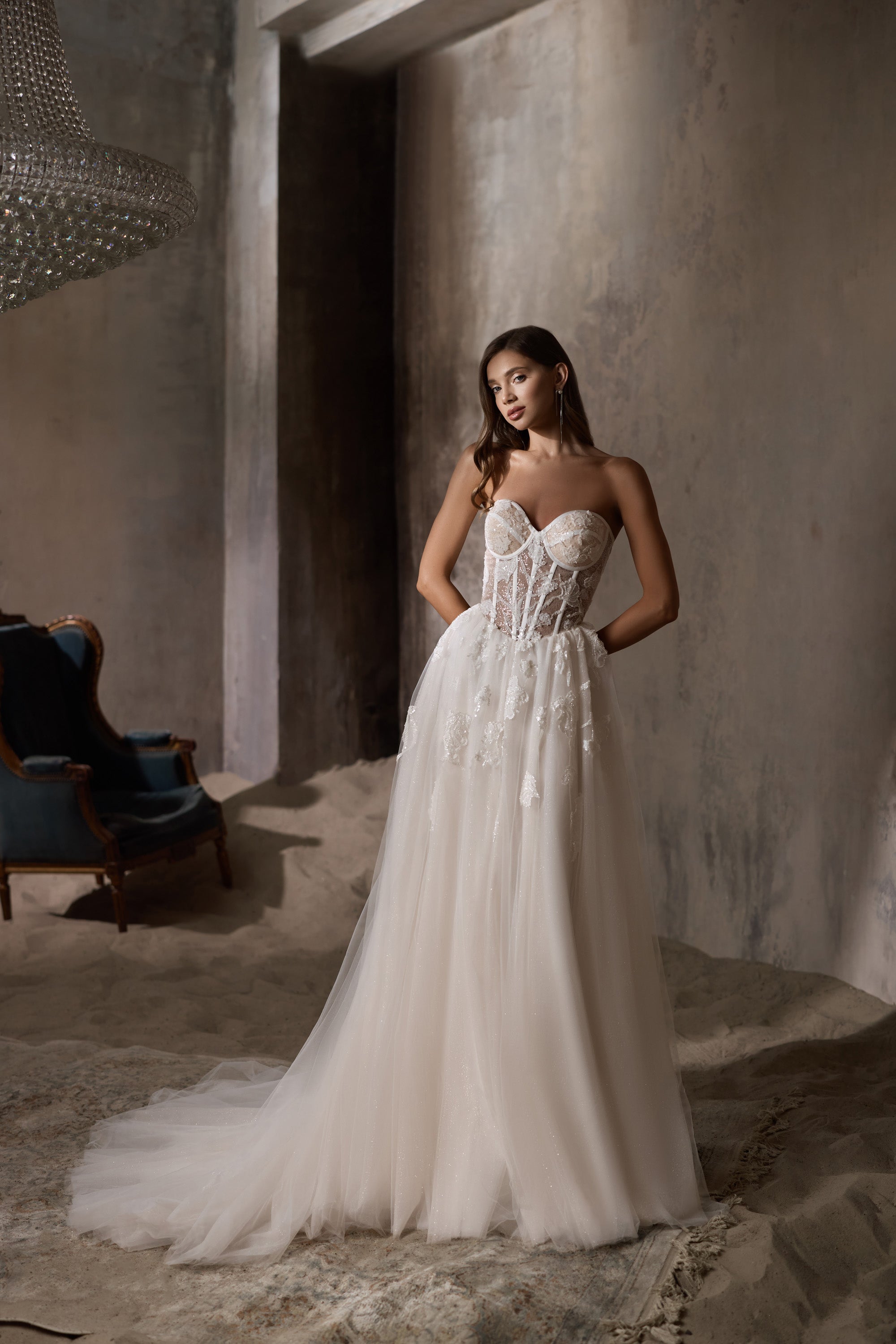 Ivory strapless A-line wedding dress with a sweetheart corset bodice and sweeping train