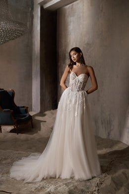 Ivory strapless A-line wedding dress with a sweetheart corset bodice and sweeping train