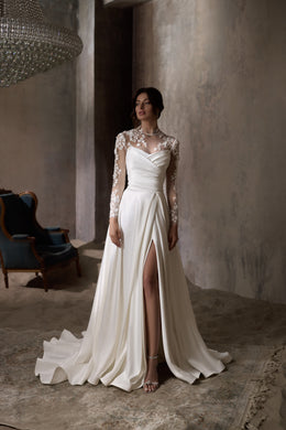 Ivory wedding dress with sheer floral lace long sleeves, a front slit, and a sweeping train
