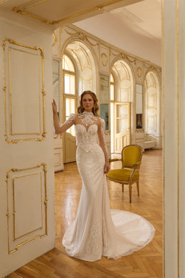 Ivory mermaid wedding dress with illusion high neckline, long lace sleeves, and a sweeping train