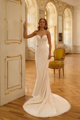 Strapless sweetheart wedding dress with beaded lace bodice, fitted mermaid skirt, and long train