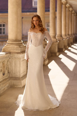 Ivory mermaid wedding dress with an off-the-shoulder neckline, long beaded sleeves, and a train