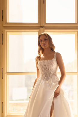 Beaded square-neck wedding dress with slender straps, a satin skirt, and a high front slit