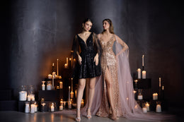 Full-length rose-gold sequined evening dress with a deep V-neckline, thigh-high slit, and flowing sheer train