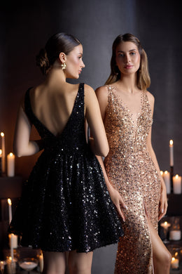 Rose-gold sequined evening dress featuring a fitted silhouette, V-neckline, thigh-high slit, and sheer train