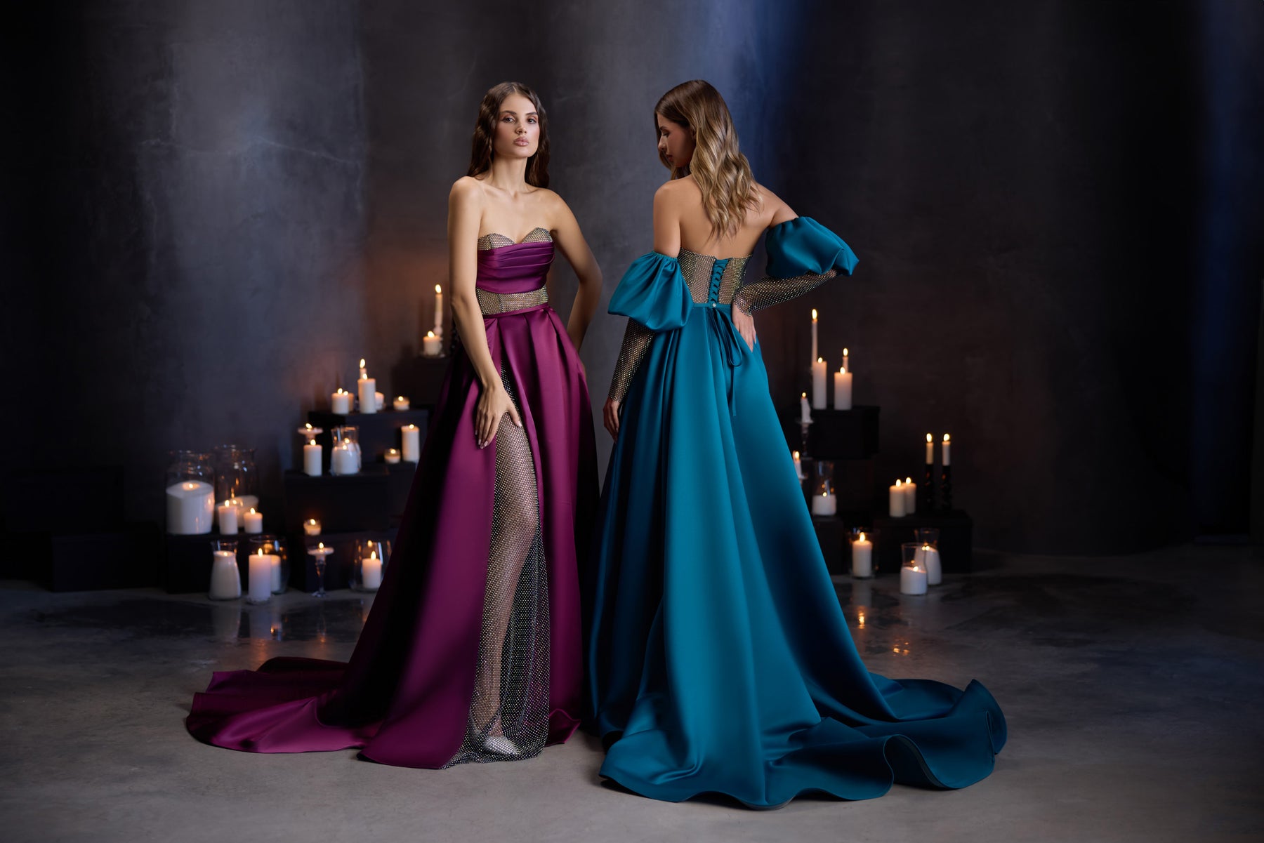 Teal evening dress shown from the back with an open back, puff sleeves, jeweled waist, and long train