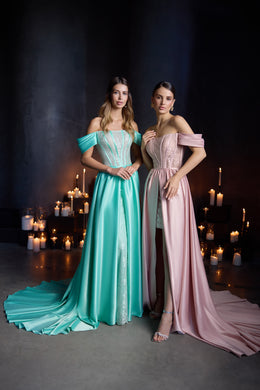 Turquoise and blush pink evening dresses with off-the-shoulder sleeves, lace bodices, and floor-length overskirts