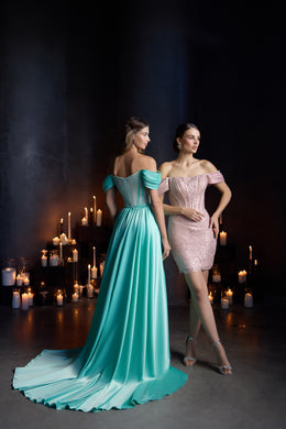 Turquoise evening dress with a long train and off-the-shoulder back, paired with a short blush pink dress