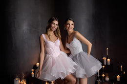 Pink evening dress featuring a sweetheart neckline, sparkling beaded bodice, and full layered skirt