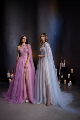 Pink beaded one-shoulder evening dress with a flowing A-line skirt and high slit, beside a pale blue gown
