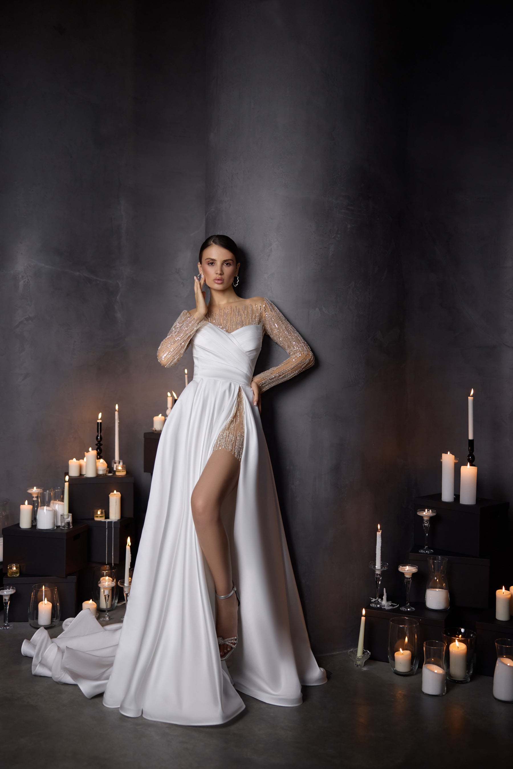 White A-line evening dress with sparkling sheer sleeves, thigh-high slit, and sweeping floor-length train