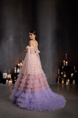 Open-back pink and lavender evening dress with tiered tulle ruffles, off-shoulder sleeves, and a sweeping train