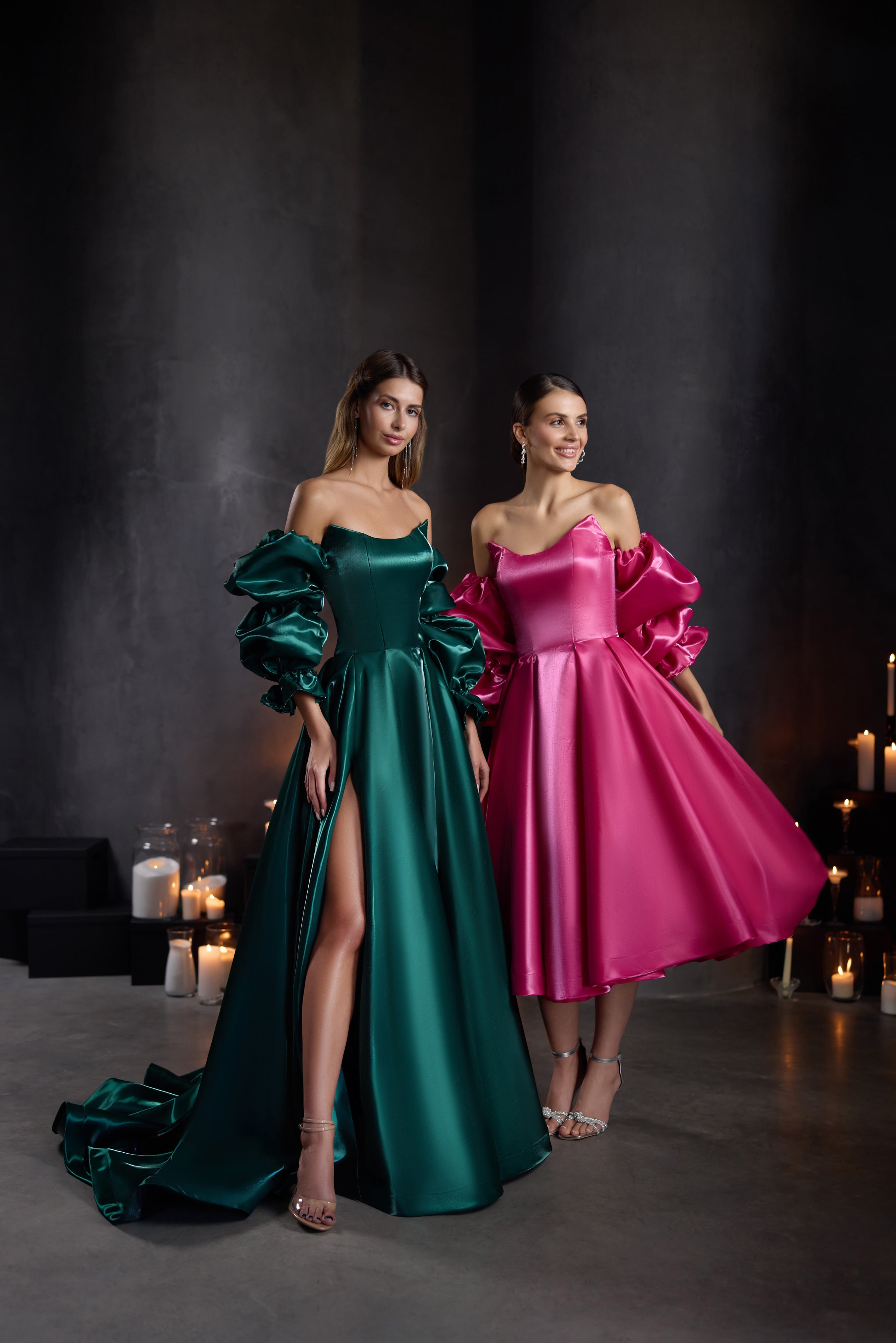 Emerald green evening dress with puff sleeves, off-shoulder neckline, thigh-high slit, and trailing hem