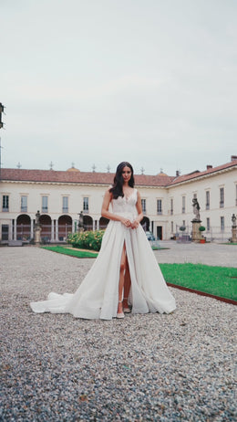 Elegant A-Line Wedding Gown with V-Neck, Straps, Slit Skirt, Lace, and Train