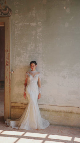 Elegant Bridal Gown Mermaid with Long Sleeves, High Neck, Lace Back, and Additional Skirt