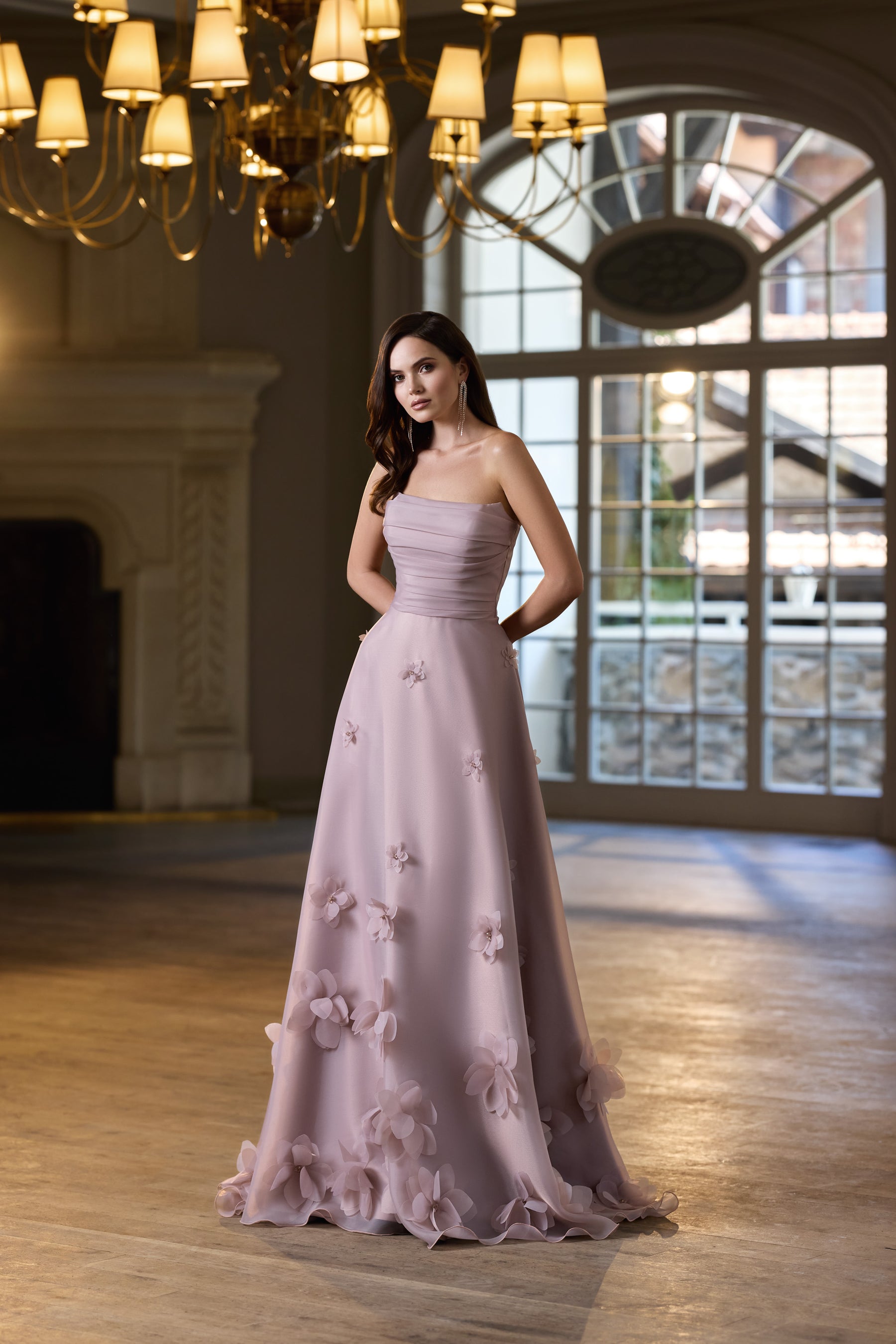 Mauve A-line evening dress with a ruched bodice, thin straps, and floral appliqués along the skirt