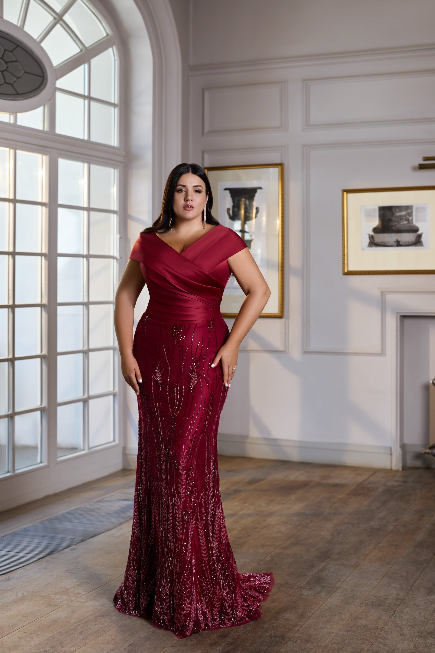 Burgundy sequined evening dress with a V-neck wrap bodice, short sleeves, fitted skirt, and trailing hem