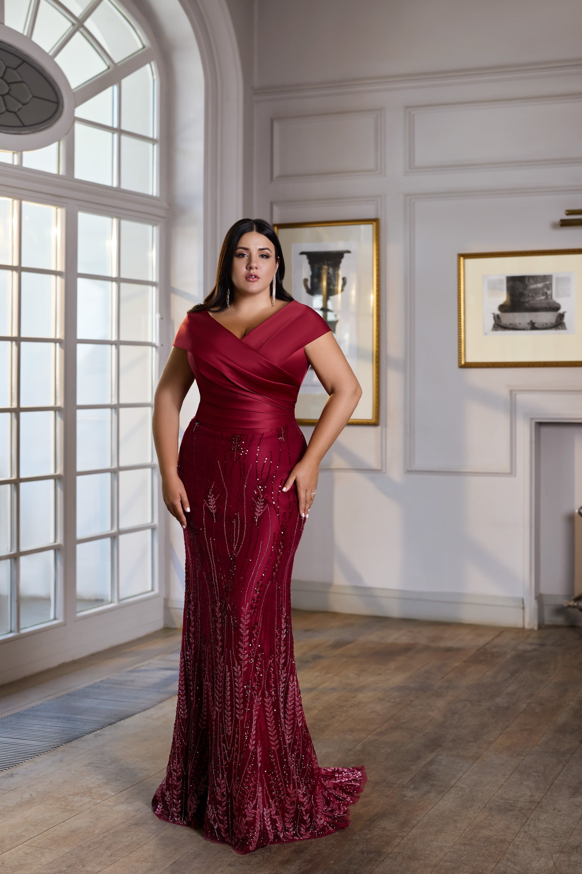 Burgundy sequined evening dress with a V-neck wrap bodice, short sleeves, fitted skirt, and trailing hem