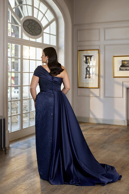 Navy evening dress featuring a fitted embellished bodice and dramatic satin back train
