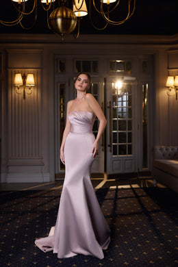 Pale pink strapless evening dress with a ruched sweetheart bodice and fitted mermaid silhouette