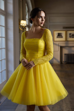 Yellow evening dress with a square neckline, sheer embellished long sleeves, and a full flared skirt