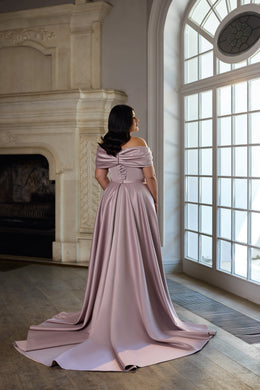 Mauve evening dress shown from behind with a draped off-shoulder neckline and flowing train