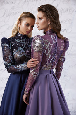 Mauve evening dress showing a sparkling sheer long-sleeve back, high neckline, and defined waist