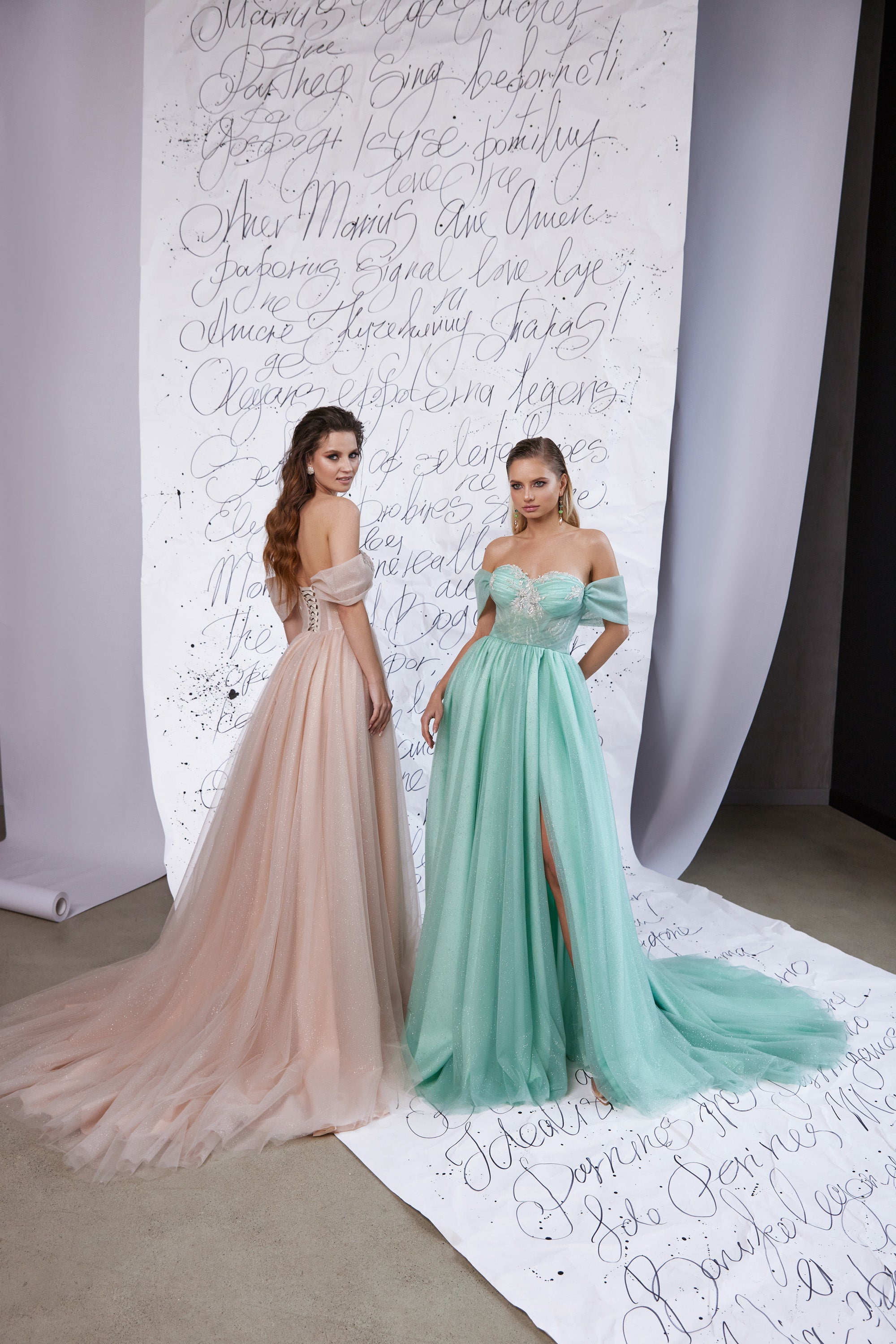 Blush and mint off-the-shoulder evening dresses with embellished bodices, flowing tulle skirts, and a thigh-high slit