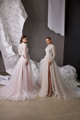 Pale pink and ivory evening dresses with beaded long sleeves, high necklines, flowing tulle skirts, and a high front slit