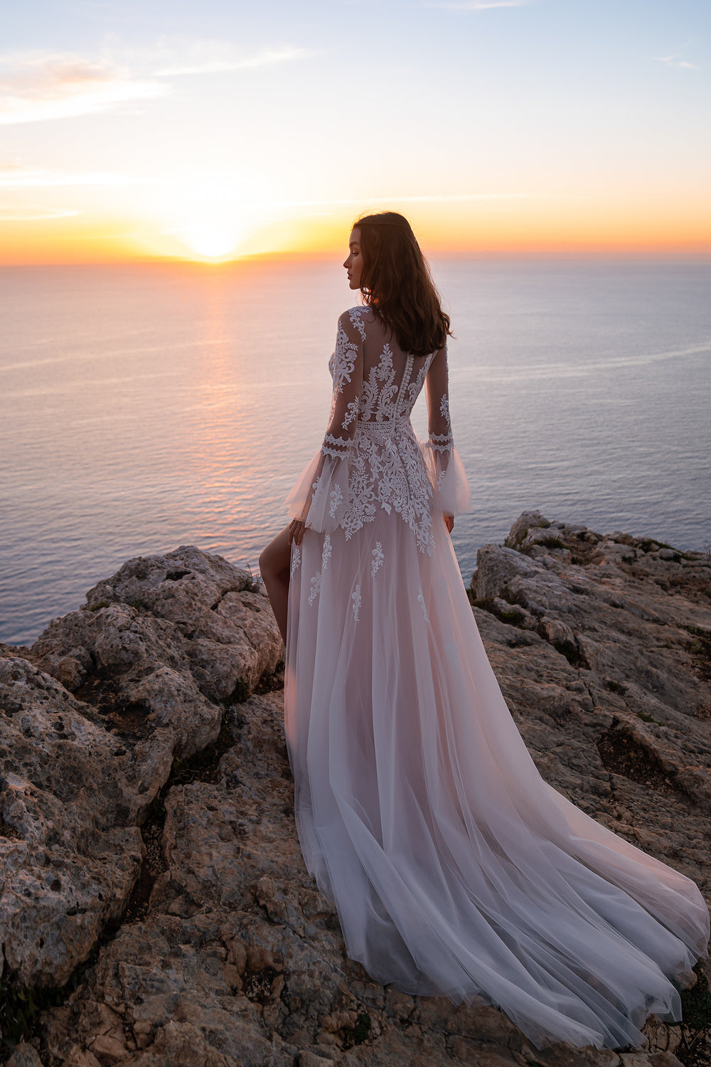 Beautiful Boho-Style Bridal Gown with Guipure Embroidery, Sequins, and Lace, Semi-Sheer Bodice with Deep V-Cut, Flared Sleeves, Slit on Left Leg, and Long Train