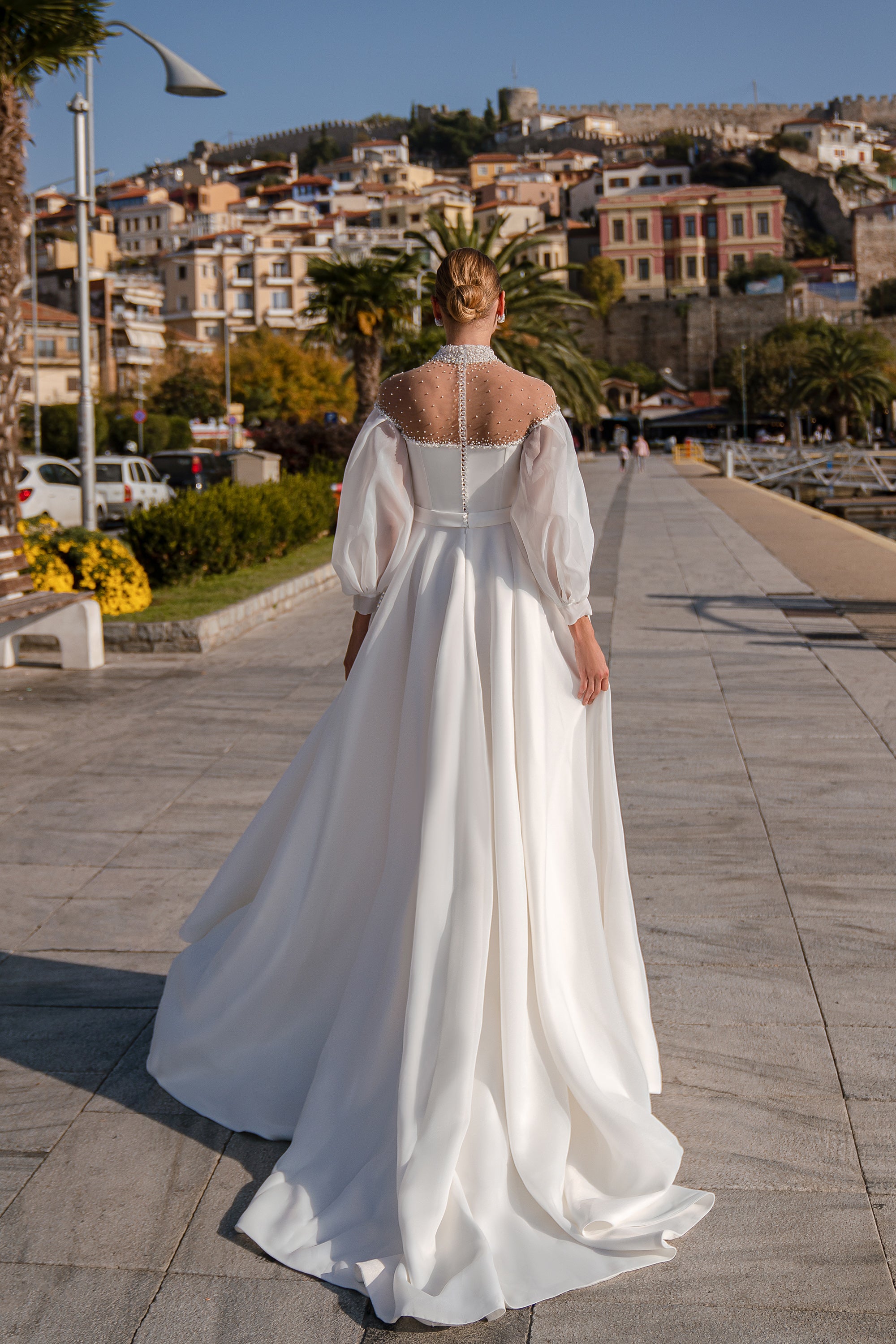 Organza and Satin Wedding Dress with Voluminous Tulle Sleeves, Hand-Embroidered Corset with Beads, Pearls and Sequins, and Crystal Buttons at the Back, with a Simple Skirt and Satin Belt