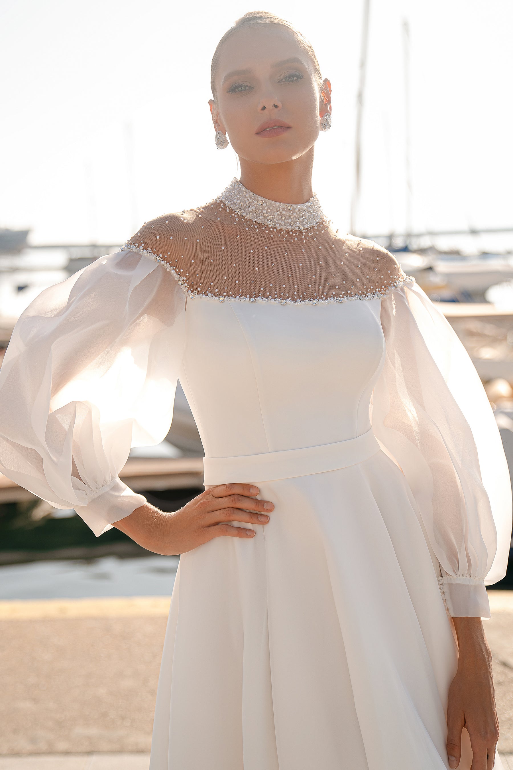 Organza and Satin Wedding Dress with Voluminous Tulle Sleeves, Hand-Embroidered Corset with Beads, Pearls and Sequins, and Crystal Buttons at the Back, with a Simple Skirt and Satin Belt
