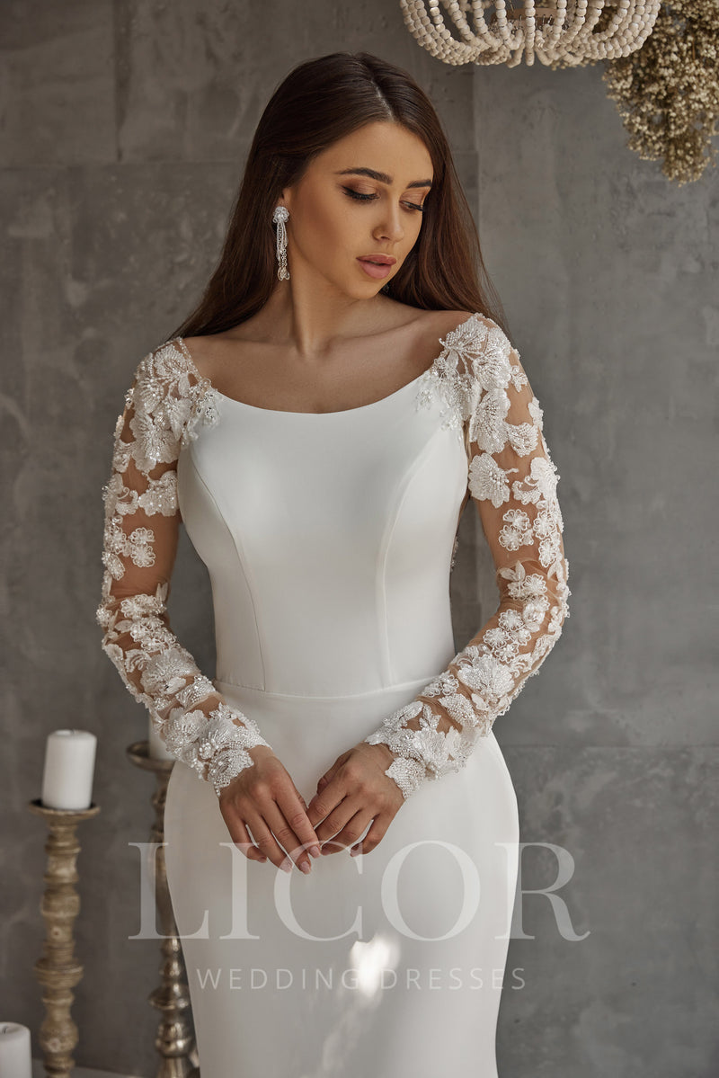 Ivory sheath wedding dress with a rounded neckline and long sheer floral lace sleeves