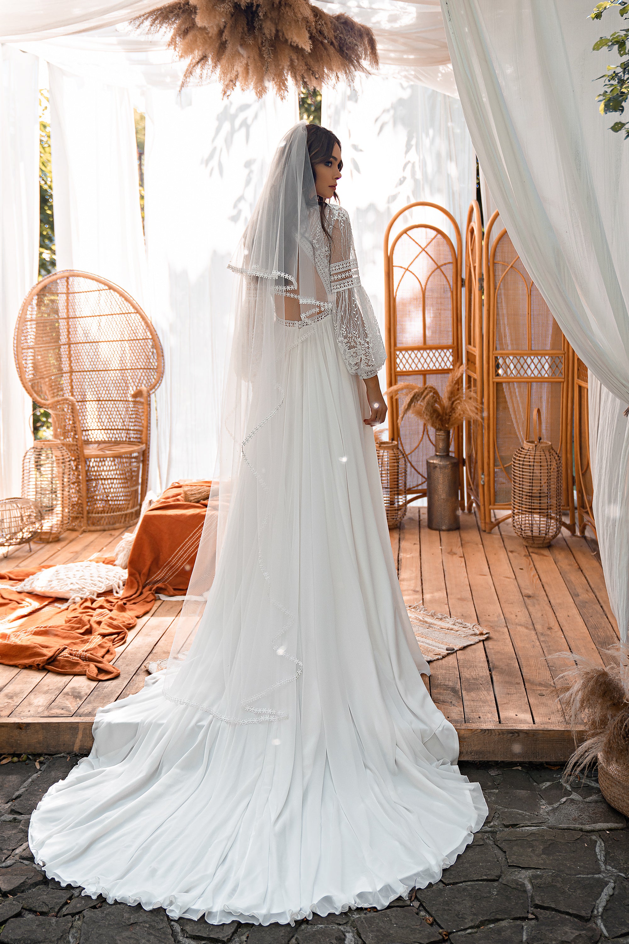 Romantic Boho Wedding Dress with Long Sleeves, Delicate Curly Cut, Airy Multi-Chiffon Skirt, and Luxurious Long Train with Guipure, Cord, and Sequins
