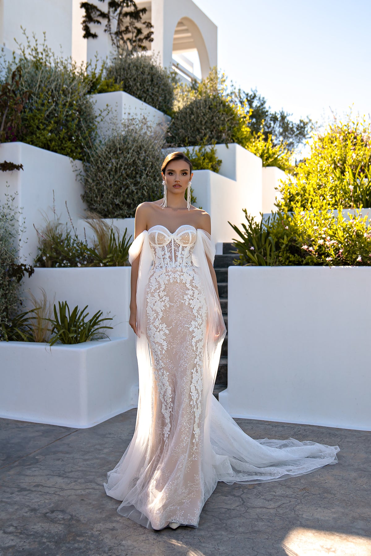 Ivory mermaid wedding dress with floral lace, sweetheart neckline, and draped off-shoulder tulle sleeves