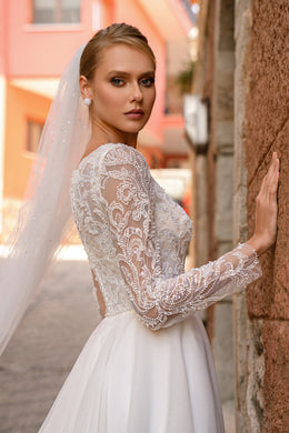 Romantic "A" Silhouette Wedding Dress with Long Sleeves, Glittering Skirt, and Hand-Sewn Beaded Belt