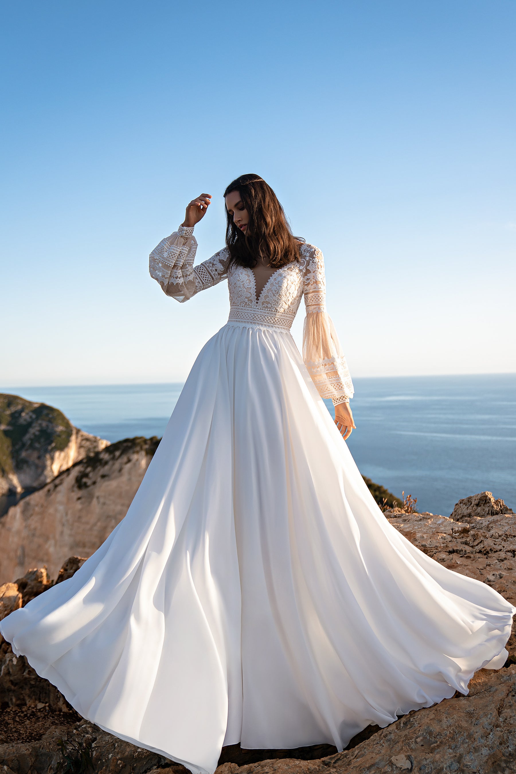 Beautiful Boho Wedding Dress with Embroidered Sequins, Lace, Long Sleeves, Corset, and Deep Cut Back