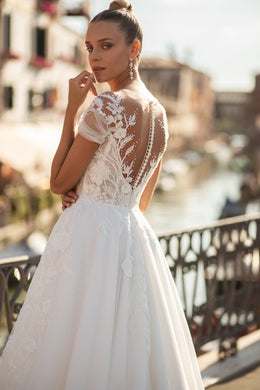 A-Line Bridal Dress with Tulle Fabric, Small Train, Lace Back with Buttons, Short Sleeves, and Flower Lace