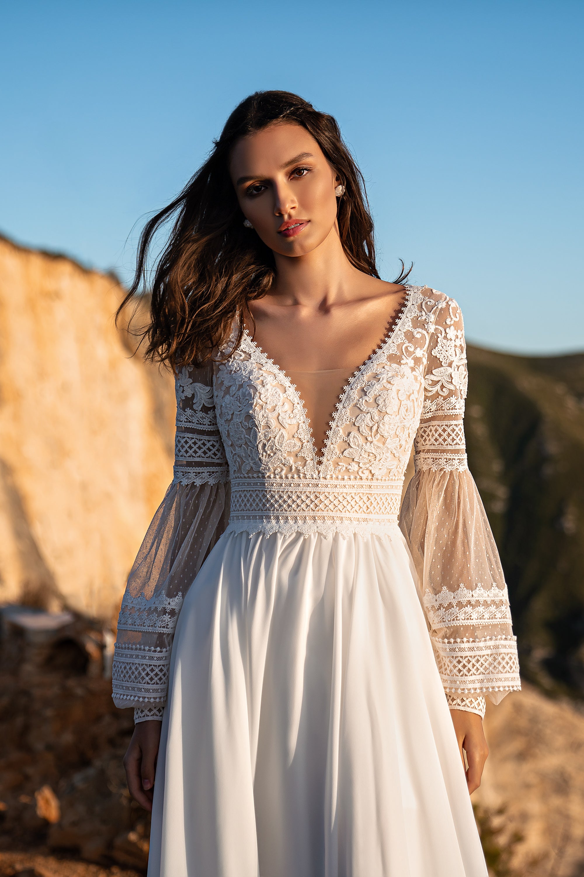 Beautiful Boho Wedding Dress with Embroidered Sequins, Lace, Long Sleeves, Corset, and Deep Cut Back