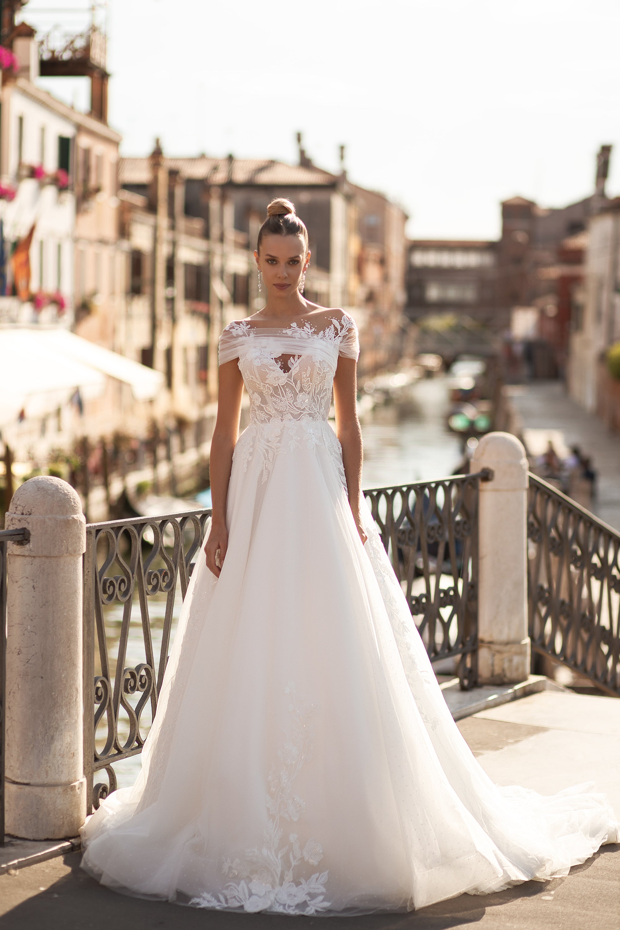 A-Line Bridal Dress with Tulle Fabric, Small Train, Lace Back with Buttons, Short Sleeves, and Flower Lace