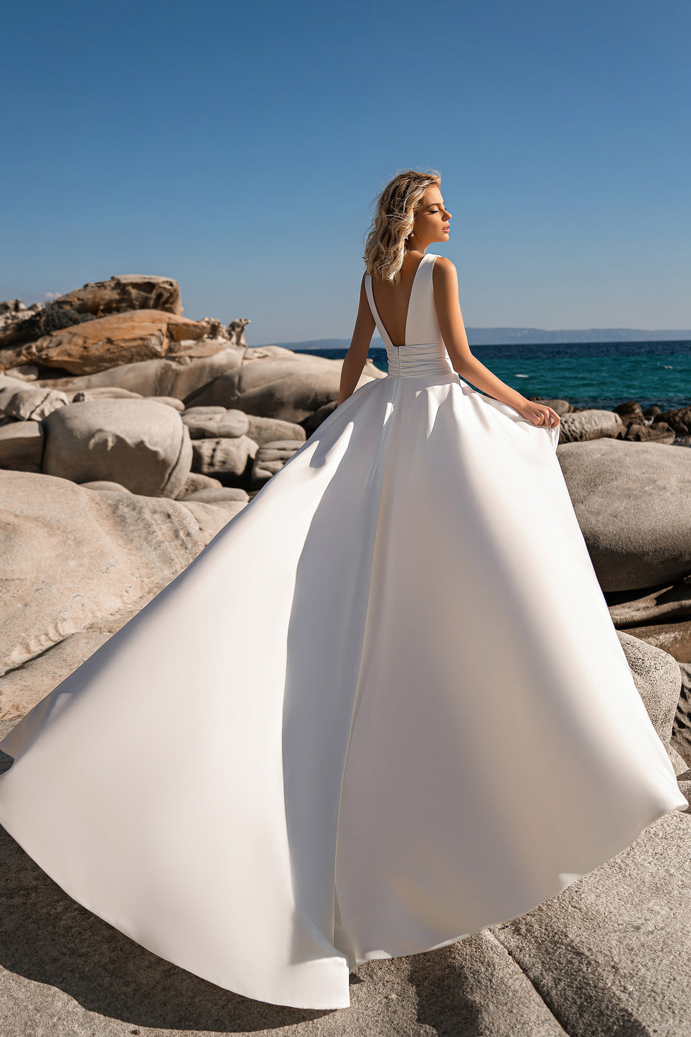 Beautiful A-Line Wedding Dress with Open Back and Chapel Train in Crepe Fabric