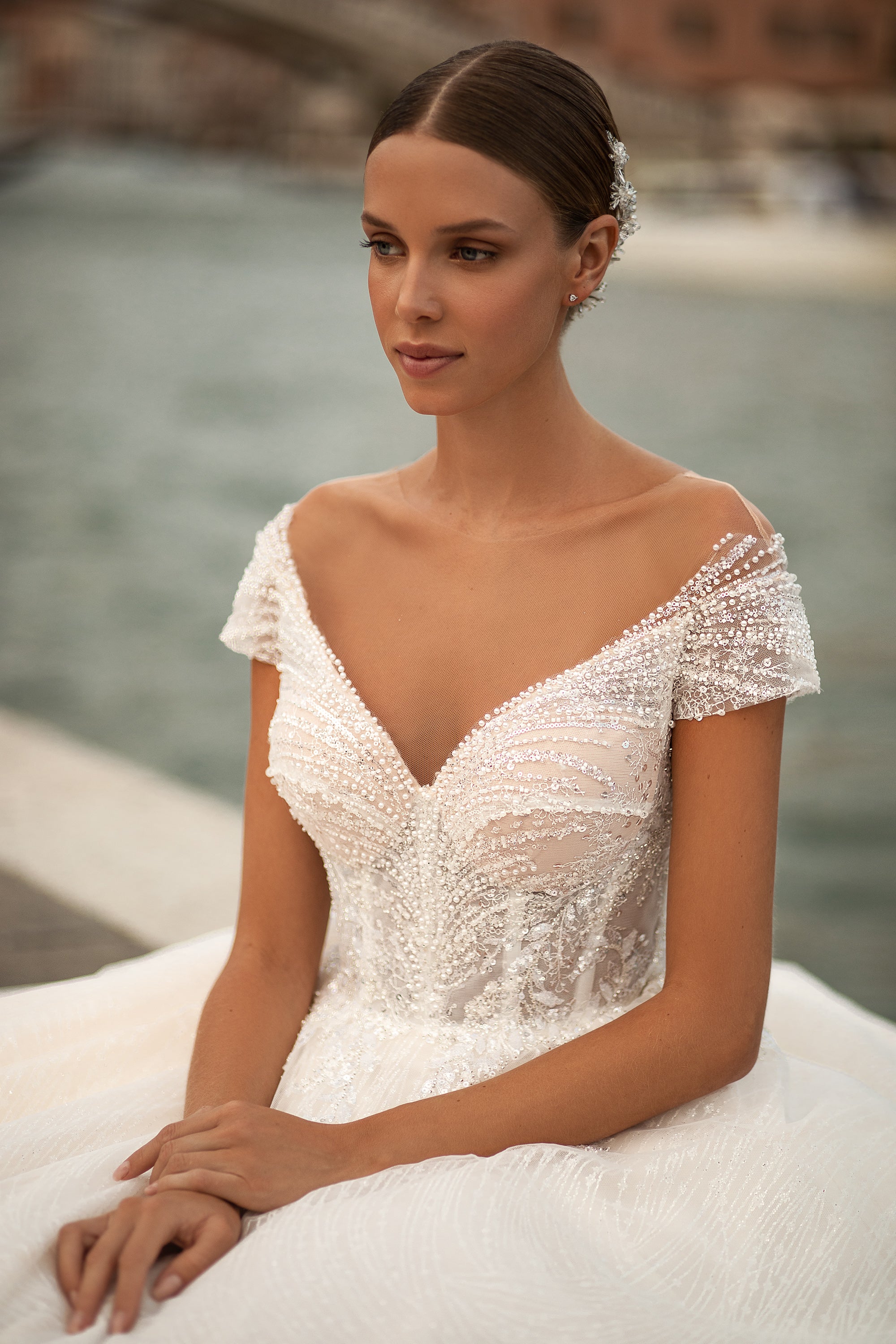 Elegant Off-Shoulder Wedding Dress with V-Neck, Beaded Lace, Low Back, Buttons at the Back, Small Train, and Lace at the Skirt