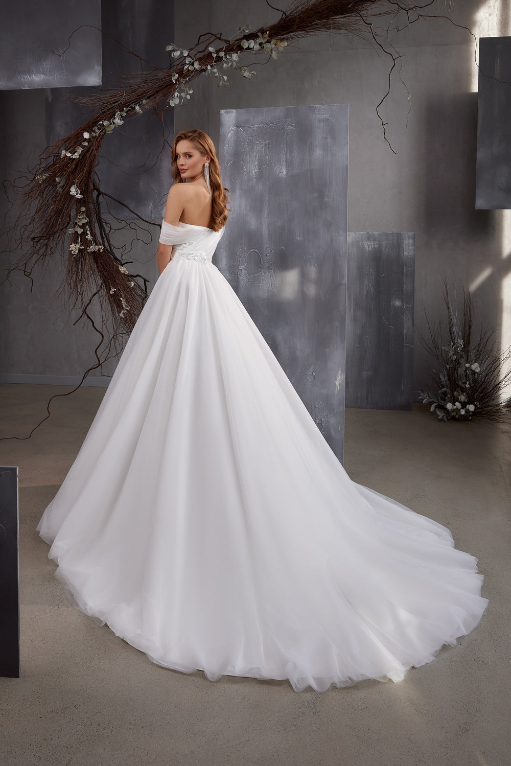 Designer Wedding Dress with Asymmetrical Yoke, Puffy Skirt, and Train - Translucent Tulle Fabric, Fold Drapery, Crystal Winglet, Guipure Embroidery, Beads, and Sequins - With Pockets