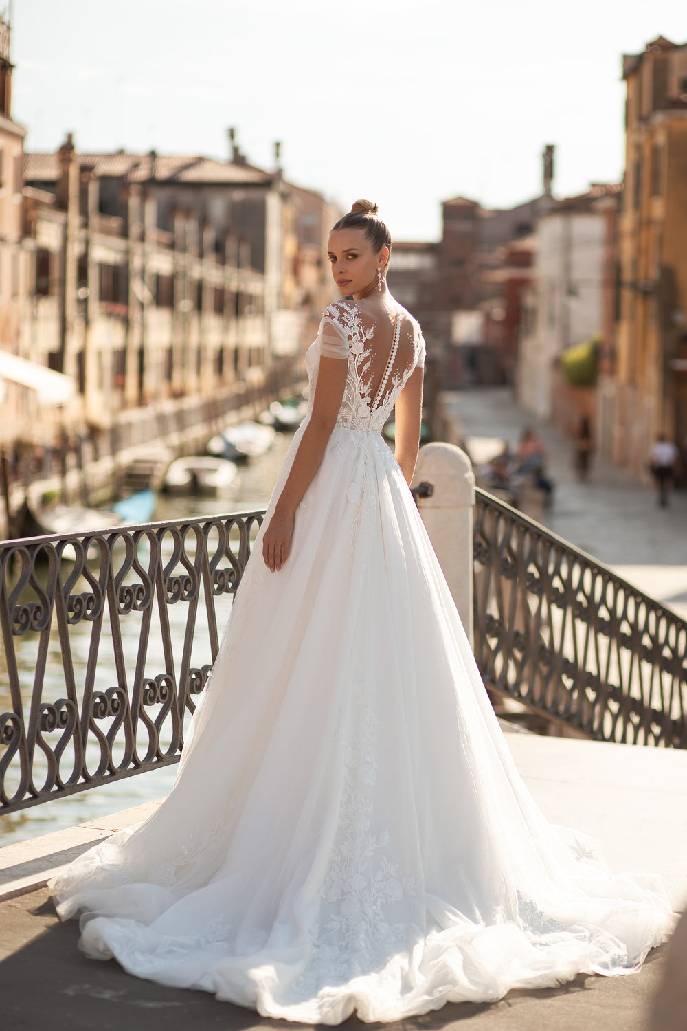 A-Line Bridal Dress with Tulle Fabric, Small Train, Lace Back with Buttons, Short Sleeves, and Flower Lace